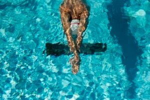 high-angle-male-swimmer-water-pool-scale