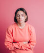 woman-wearing-casual-sweater-background-suffering-stomach-ache-with-painful-grimace-feeling-sudden-period-cramps-gynecology-concept-scaled