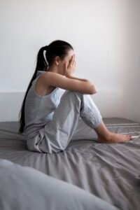 depressed woman on the bed