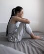 depressed woman on the bed