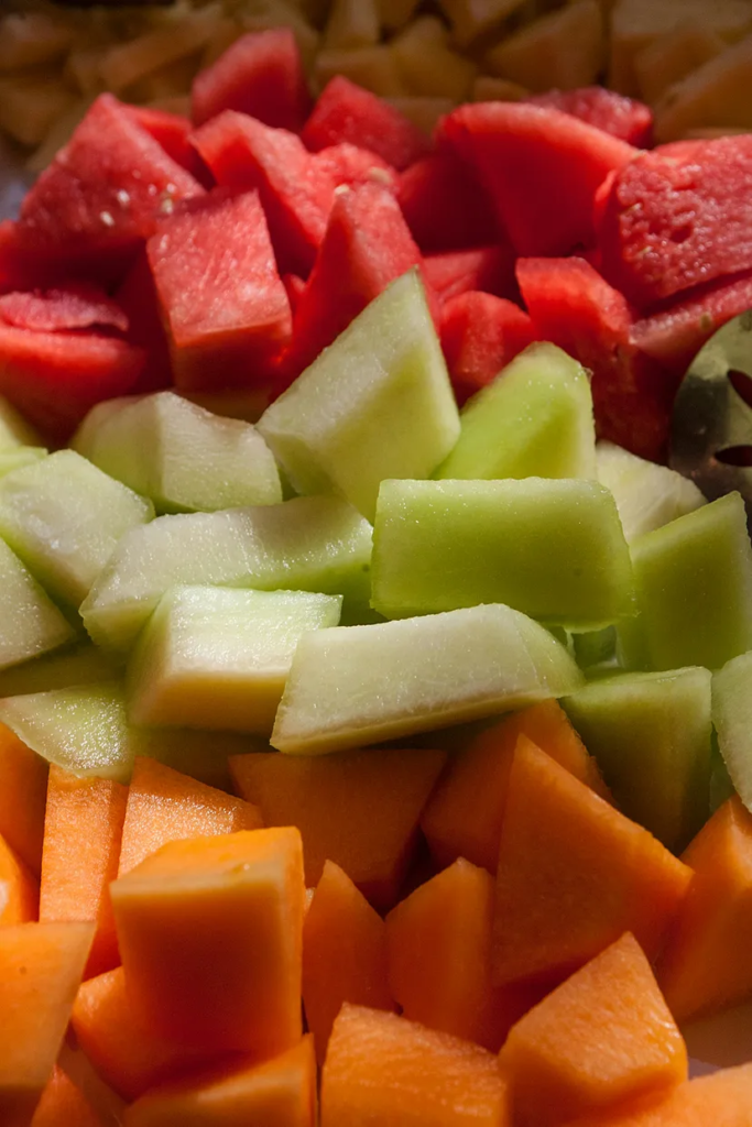 Fruit platter with watermelon abd cantalopes added in it.