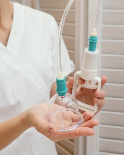 close-up-therapist-holding-cupping-tool